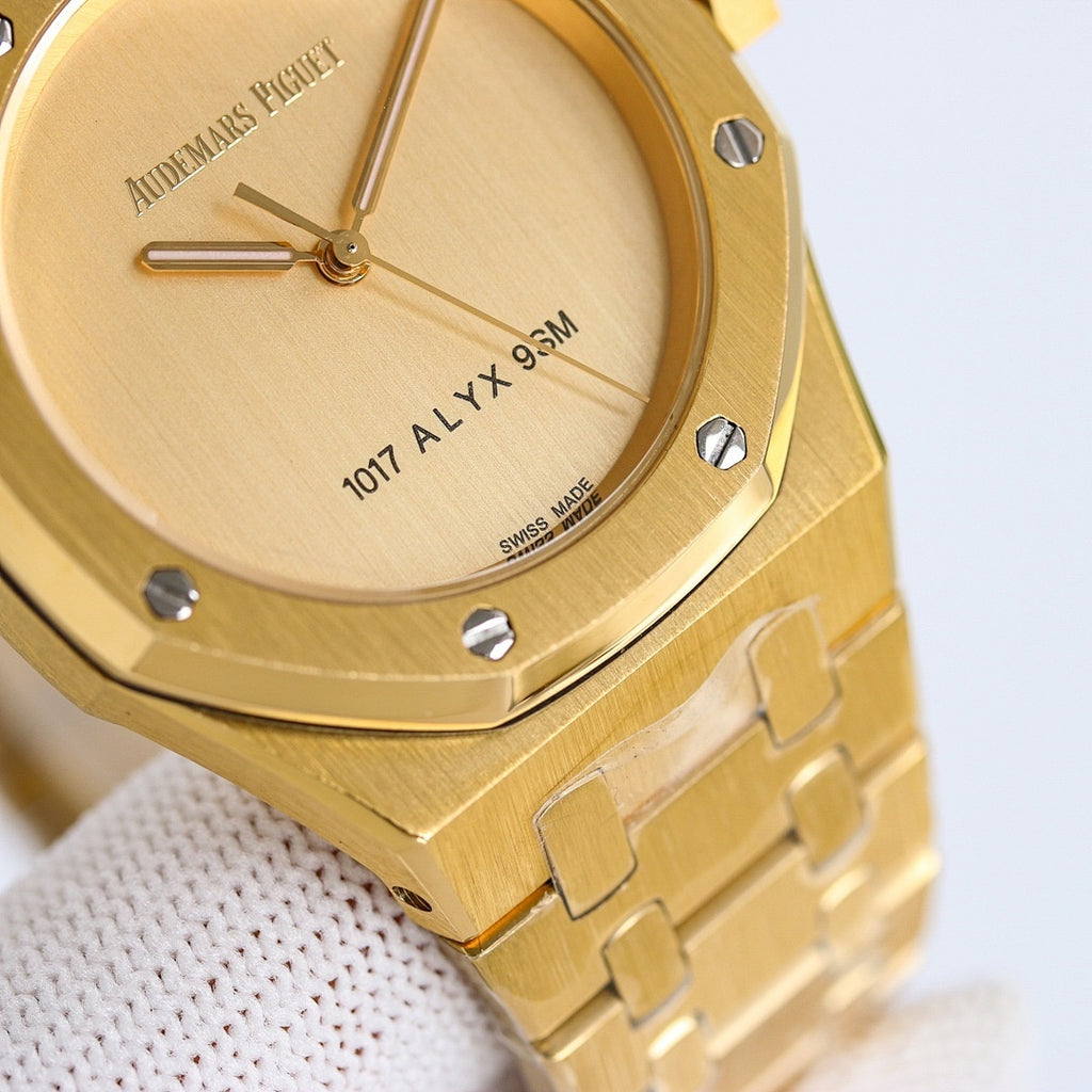 Gold-tone wristwatch close-up of dial with hands and “1071 ALYX 9SM” text