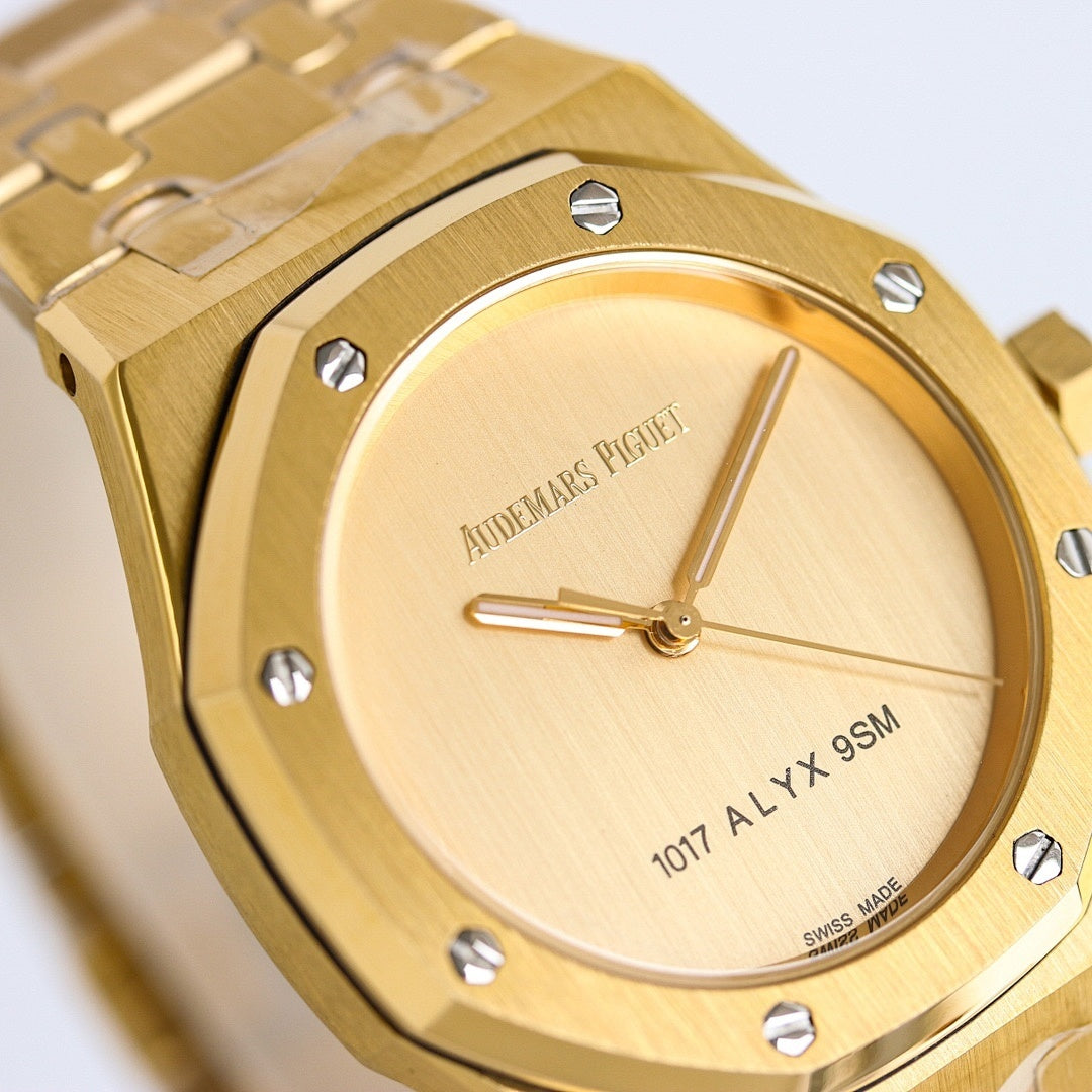 Gold-tone wristwatch close-up of round dial with hands and bezel studs