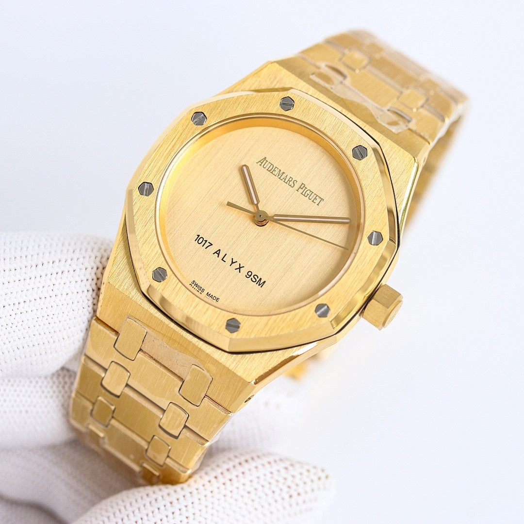 Gold-tone wristwatch with round dial and integrated metal link bracelet