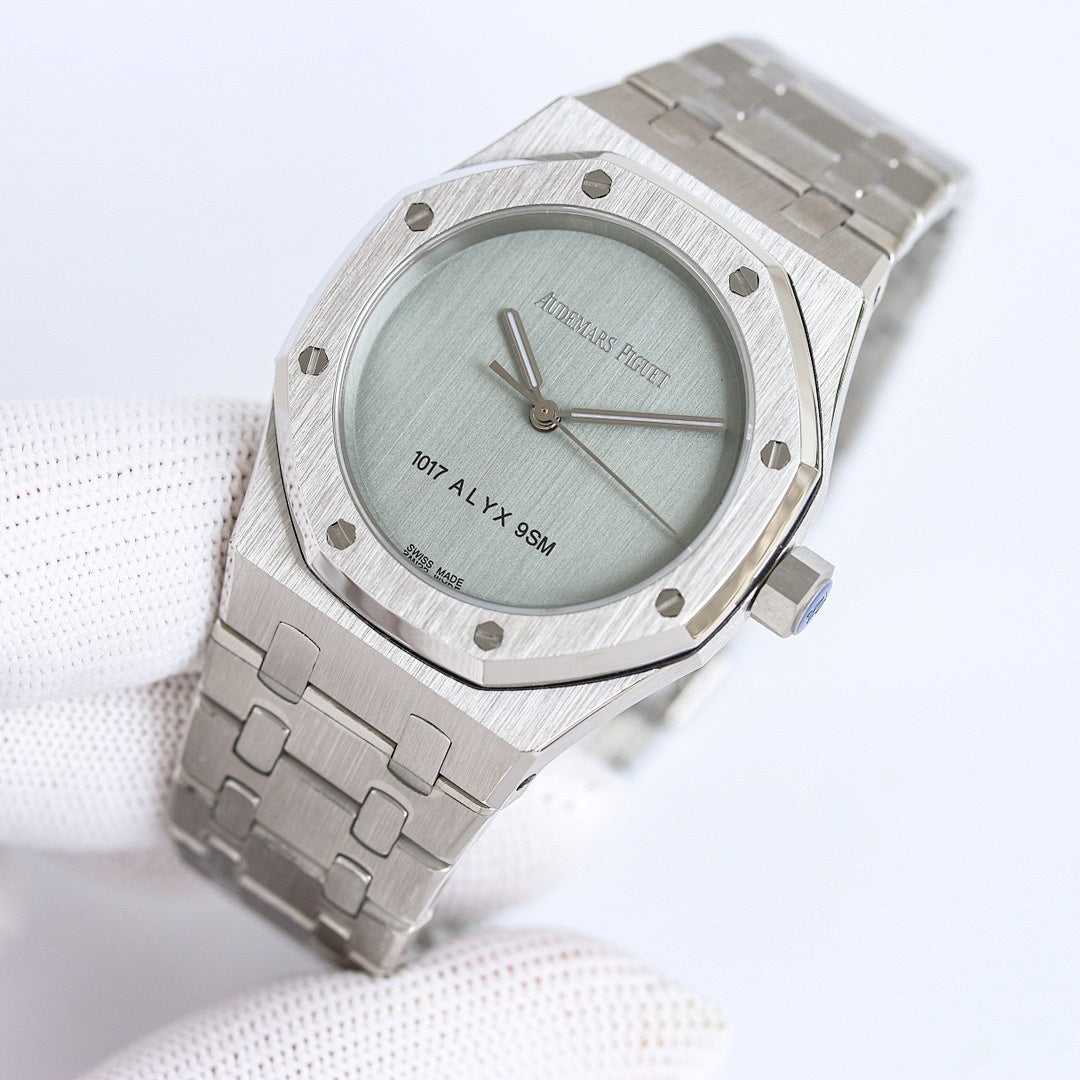Audemars Piguet watch on wrist with light green dial and stainless steel links