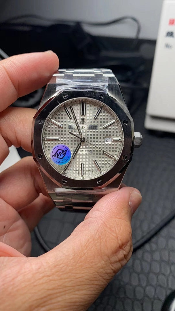 Audemars Piguet stainless steel watch with white textured dial and blue logo