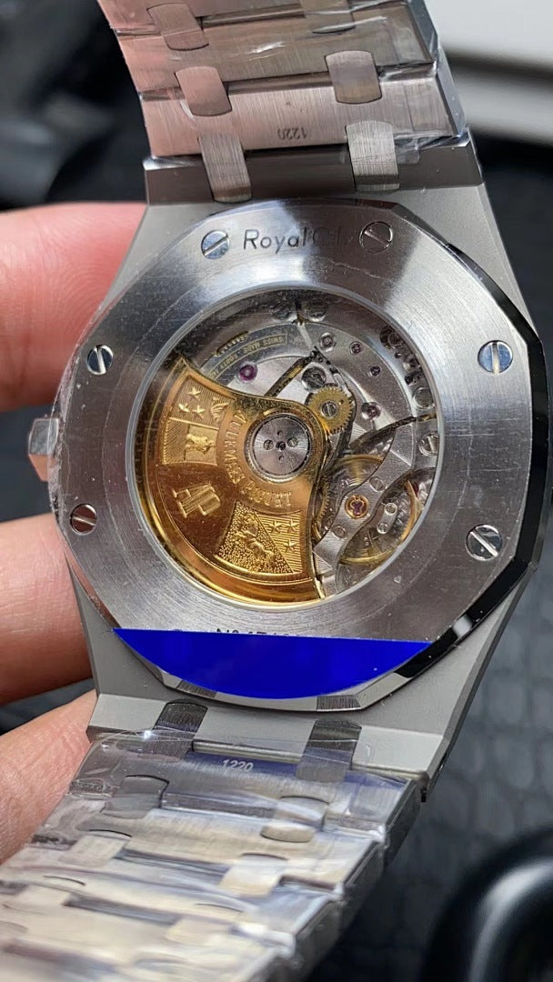 Audemars Piguet watch caseback with visible mechanical movement under glass