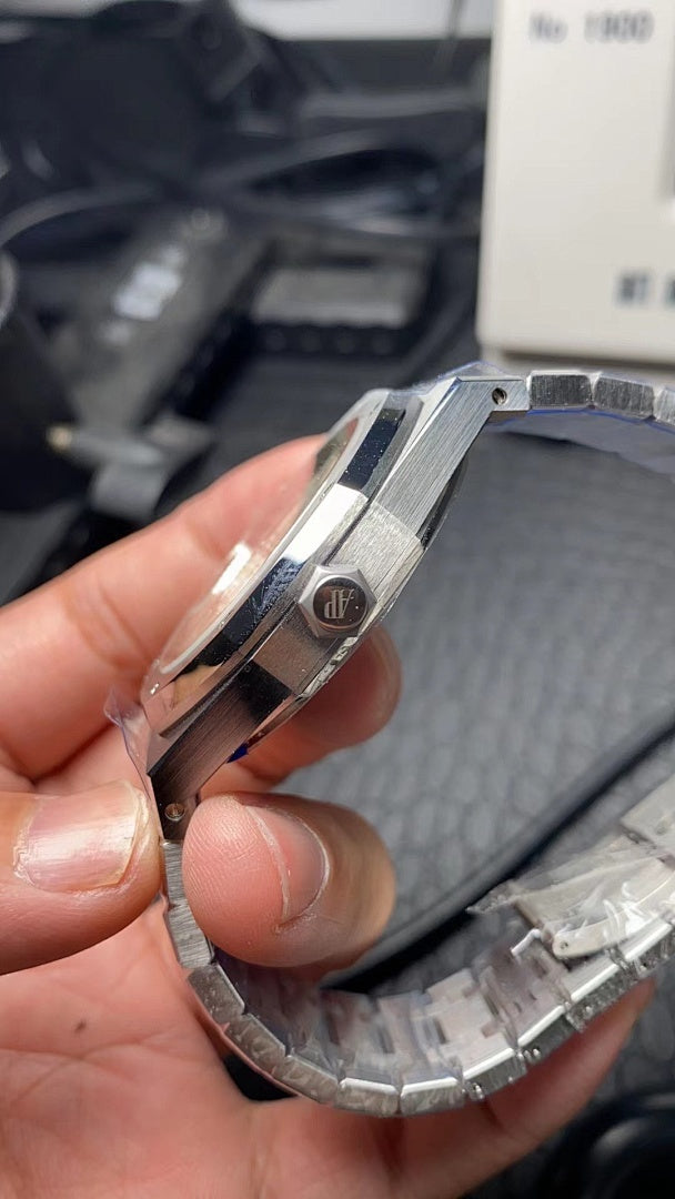 Audemars Piguet watch side profile with crown and metal bracelet links