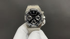Audemars Piguet stainless steel chronograph watch with black dial and three subdials, bracelet strap