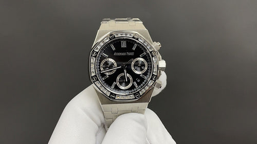 Audemars Piguet stainless steel chronograph watch with black dial and three subdials, bracelet strap