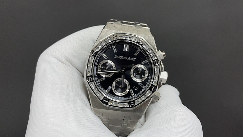 Audemars Piguet stainless steel chronograph watch with black dial and bezel markers