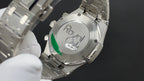 Stainless steel watch caseback engraved "Royal Oak", with metal bracelet links