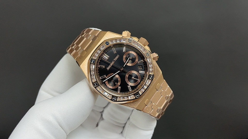 Gold Royal Oak chronograph wristwatch with black dial and stone-set bezel