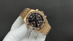 Gold Royal Oak chronograph wristwatch with black dial and stone-set bezel