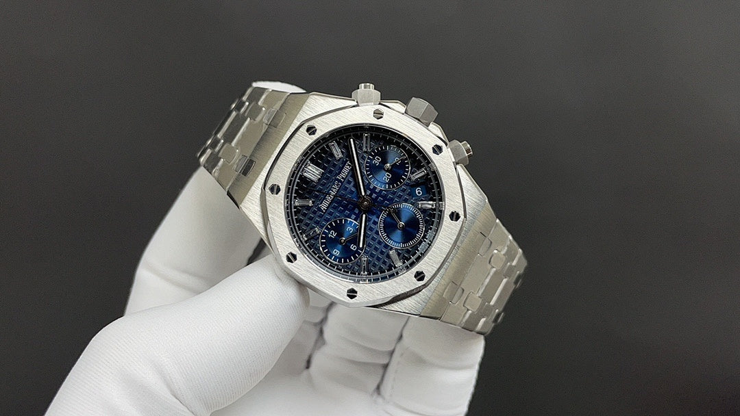 Audemars Piguet steel wristwatch with blue chronograph dial and linked bracelet