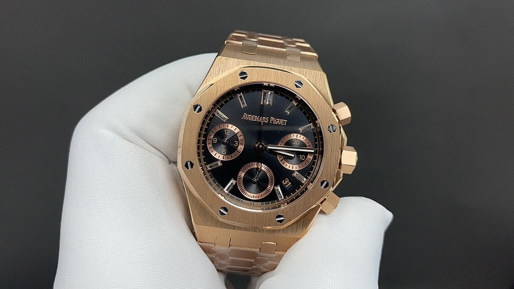 Audemars Piguet gold-tone wristwatch with black dial, baton markers, subdials