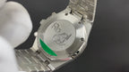 Audemars Piguet watch back case with engraved CK logo, metal bracelet.