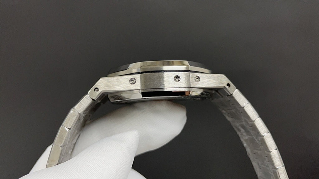 Audemars Piguet watch case profile with metal bezel and crown guards.