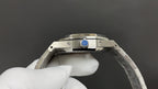 Audemars Piguet watch crown with blue accent on stainless case.
