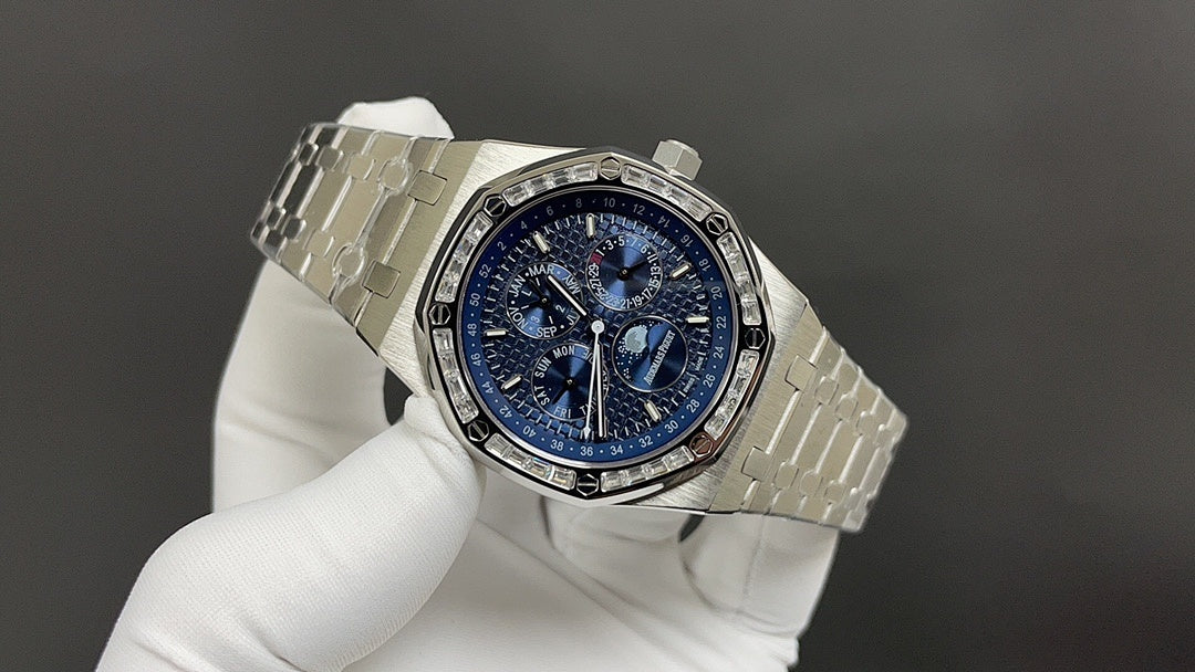 Audemars Piguet watch three-quarter view with blue dial and silver steel bracelet.