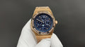 Gold-tone Audemars Piguet chronograph watch with blue dial and gold bracelet