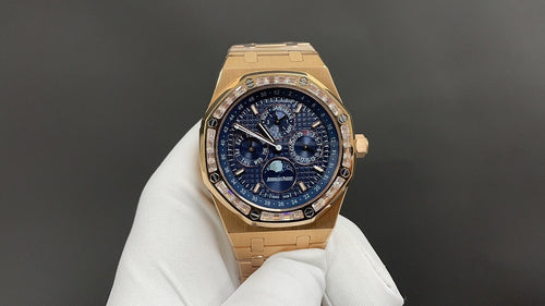 Gold-tone Audemars Piguet chronograph watch with blue dial and gold bracelet