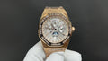 Gold-tone Audemars Piguet watch with silver dial and bracelet