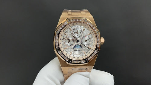 Gold-tone Audemars Piguet watch with silver dial and bracelet