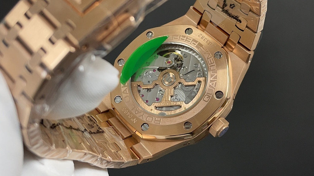 Gold-tone Audemars Piguet watch caseback close-up with mechanical movement