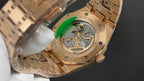 Gold-tone Audemars Piguet watch caseback close-up with mechanical movement