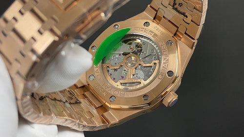 Gold-tone Audemars Piguet watch caseback close-up with mechanical movement