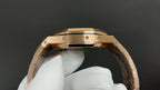 Gold-tone Audemars Piguet watch caseback underside with screws