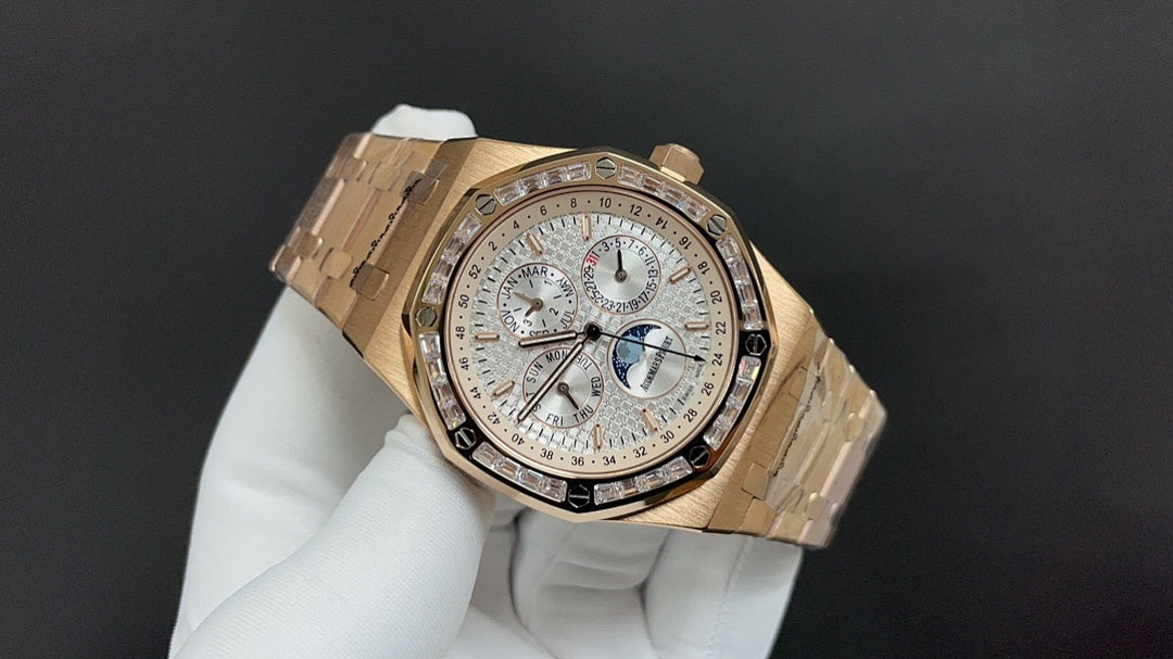 Gold-tone Audemars Piguet watch angled view with silver dial and subdials