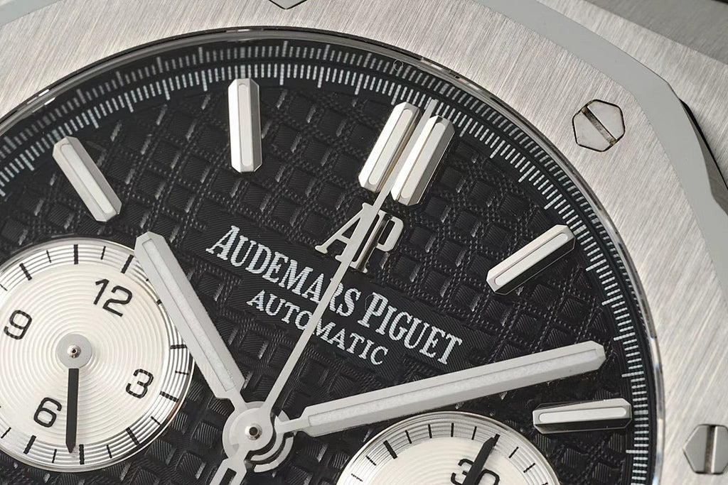 Audemars Piguet watch face close-up with black dial and Arabic subdial hands