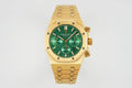 Gold-tone wristwatch with green dial, three subdials, and metal bracelet