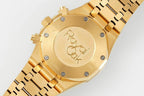 Gold-tone watch caseback with AP engraving and multiple screw heads