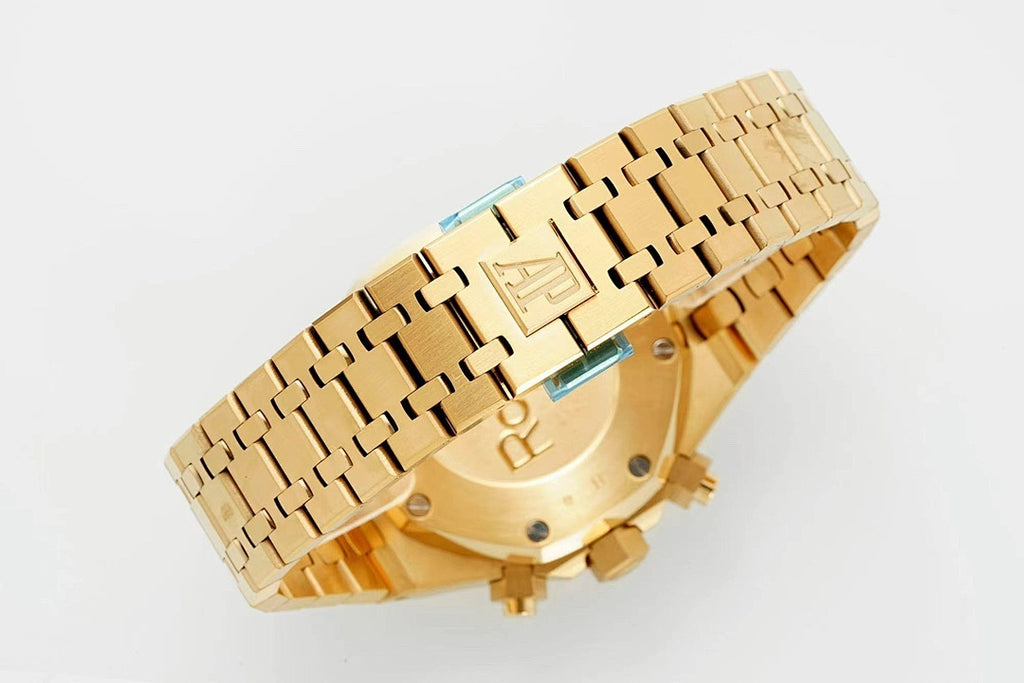 Gold-tone metal bracelet and clasp with engraved links and screws