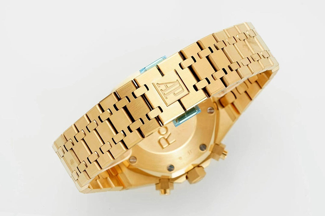 Gold-tone metal bracelet and clasp with engraved links and screws