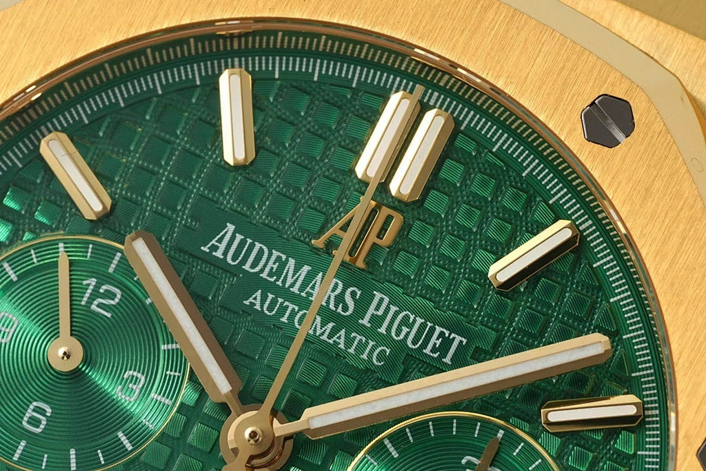 Green dial with gold-tone hands, chapter ring numerals, and AP markers