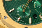 Green dial detail with subdial and gold indices reading Swiss Made