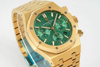 Gold-tone wristwatch with green dial, three subdials, and metal bracelet