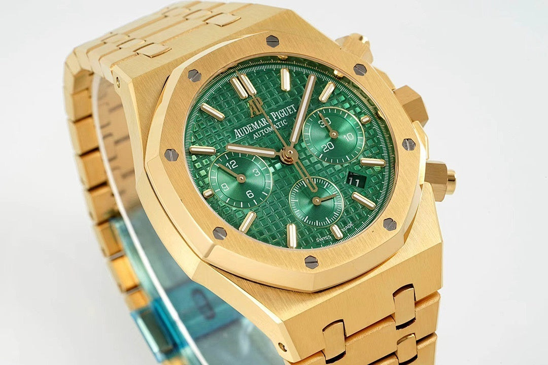 Gold-tone wristwatch with green dial, three subdials, and metal bracelet