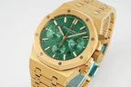 Gold-tone wristwatch with green dial and chrono-style subdials on bezel