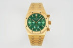 Gold-tone wristwatch with green dial, three subdials, and full link bracelet