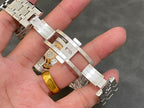 Stainless steel wristwatch back and bracelet clasp with visible engraved markings