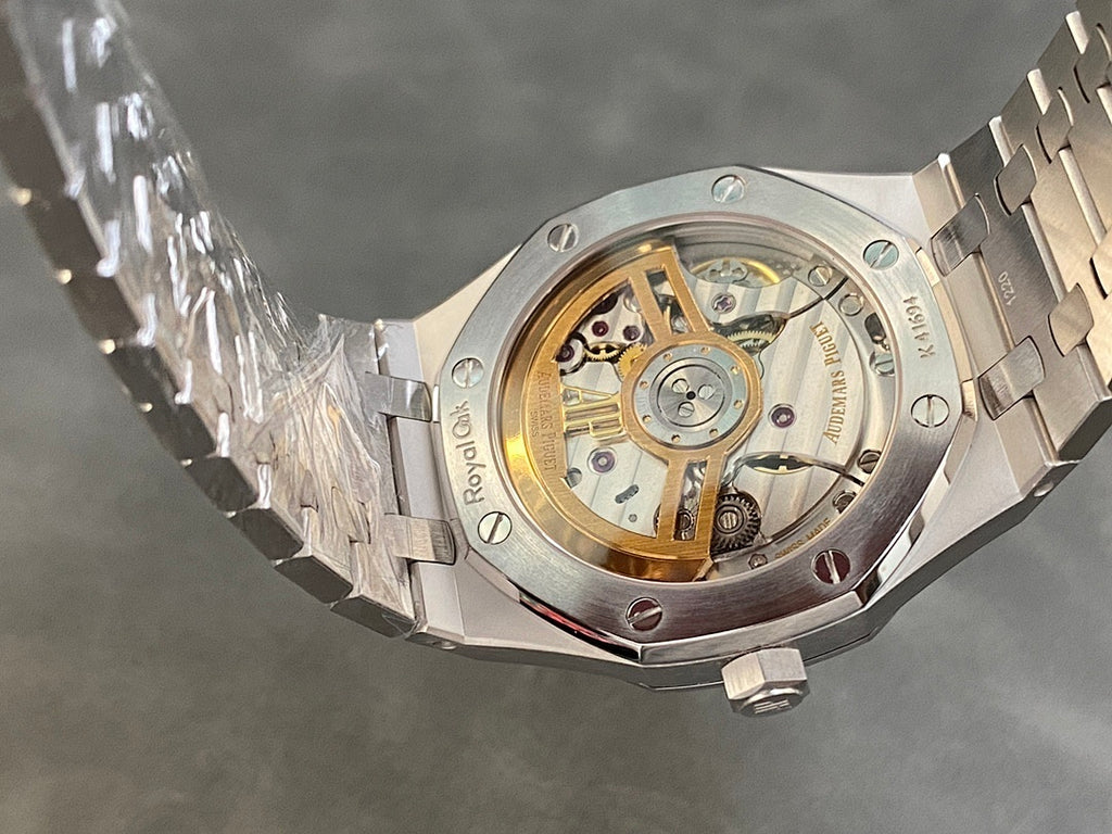 Stainless steel wristwatch caseback showing exposed mechanical movement