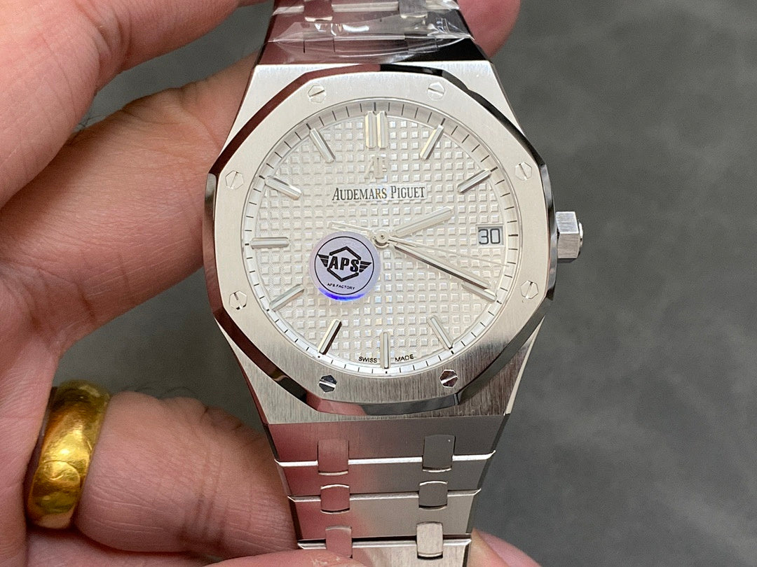 Stainless steel wristwatch with white dial, date at 30, and metal bracelet