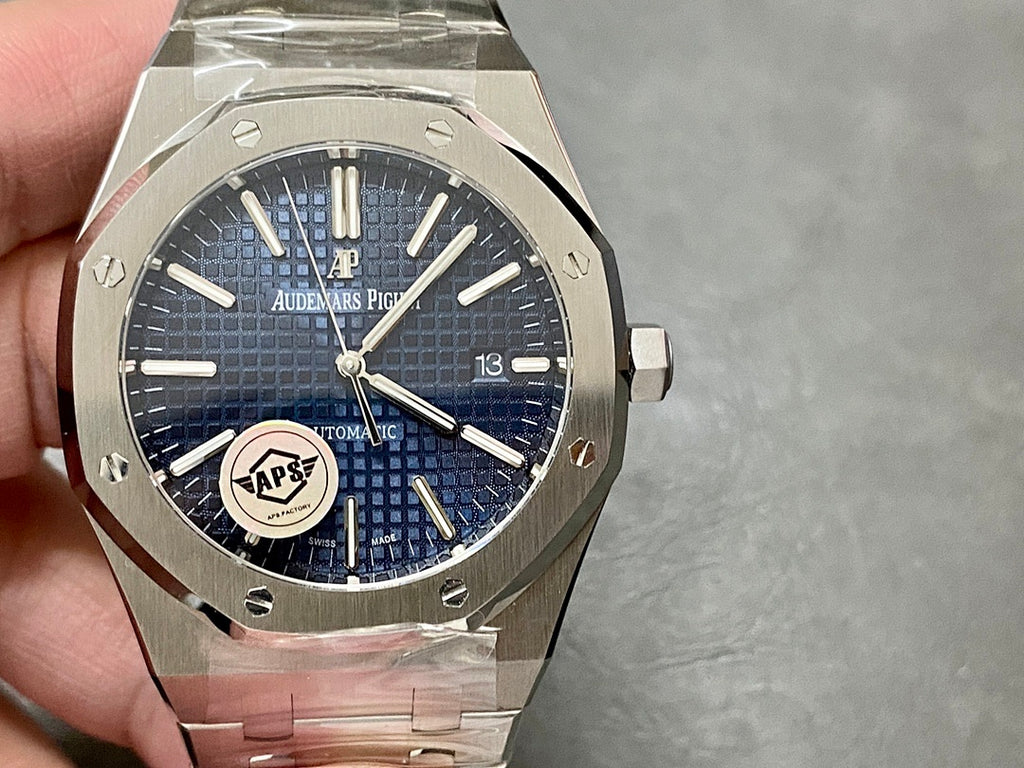 Audemars Piguet steel watch with blue textured dial, centered logo, date window at 3
