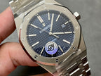 Audemars Piguet steel watch with blue textured dial, three hands, date window at 3