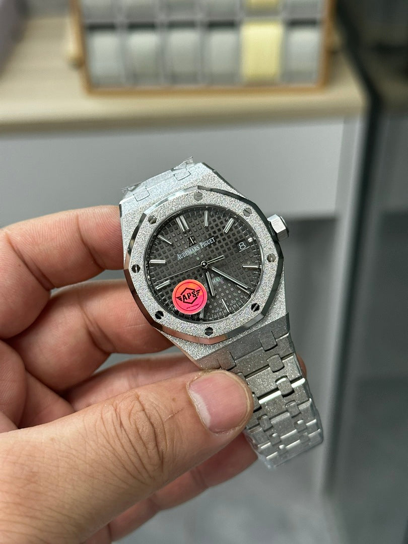 Audemars Piguet watch with grey dial and pink logo, steel case and bracelet