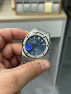 Audemars Piguet stainless steel wristwatch with blue dial and integrated steel bracelet