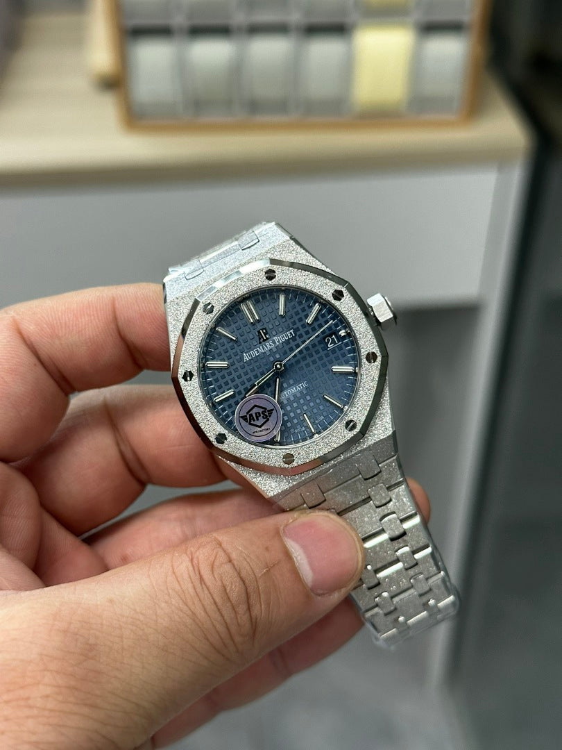Audemars Piguet stainless steel wristwatch front view with blue dial and metal bracelet