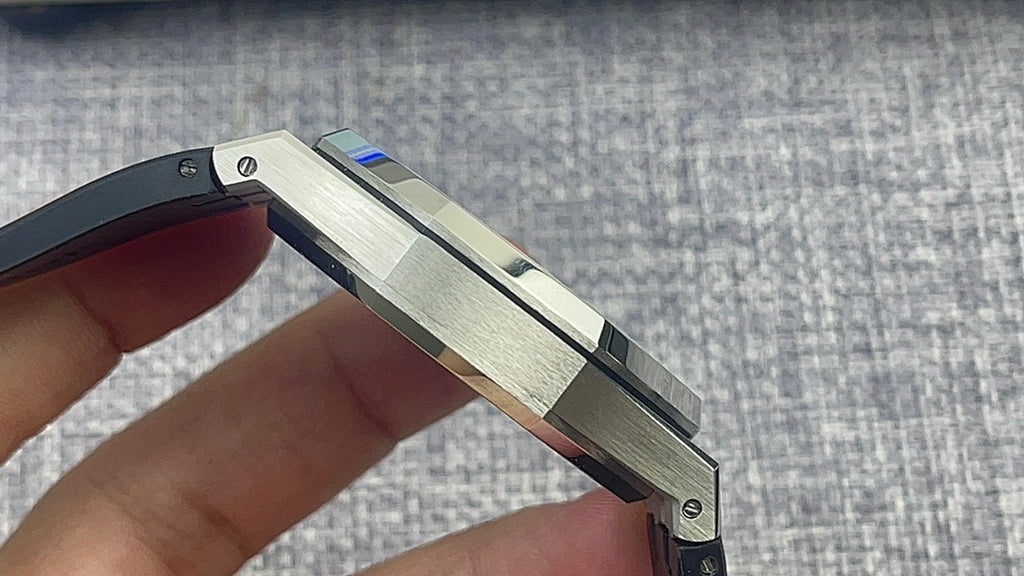 Audemars Piguet watch case side with stainless steel body and black rubber bezel