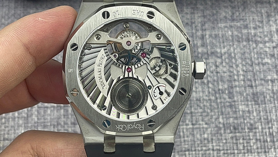 Audemars Piguet watch with transparent case back showing mechanical movement