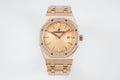 Audemars Piguet watch with rose gold bracelet, gem bezel, and champagne dial